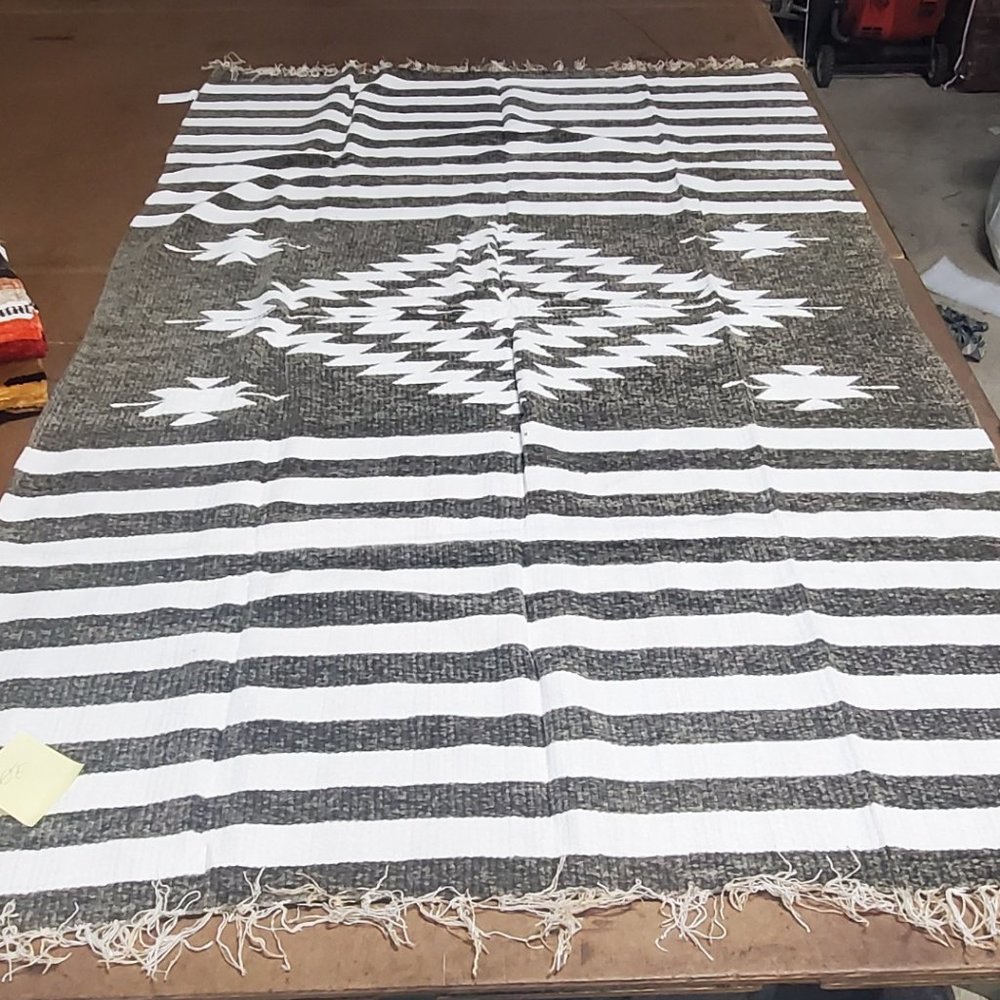 Hand woven chenille blanket with fringes